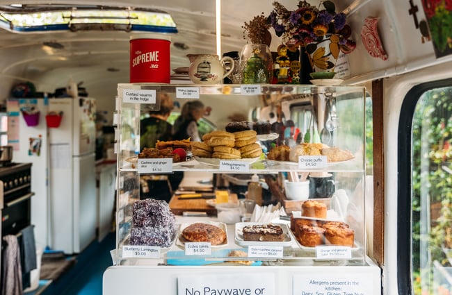 Cafe food displayed inside a cabinet.