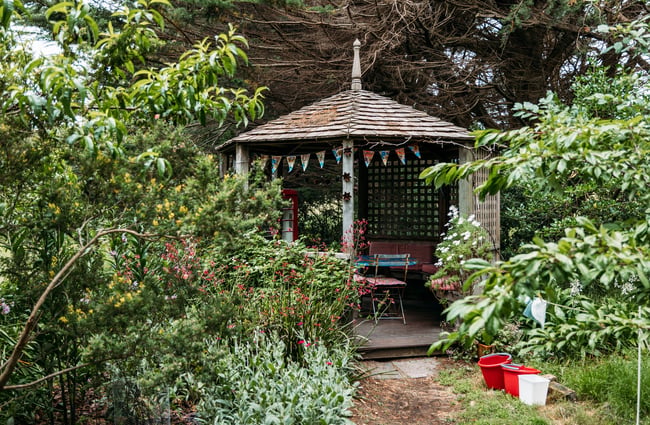 A covered outdoor eating area at The Bus Stop Cafe in Kapiti.