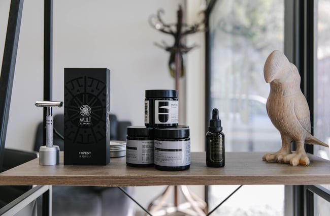 Hair products on a shelf.