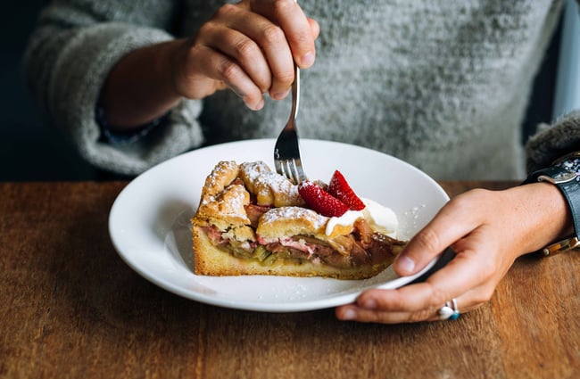 Close up of a rhubarb shortcake being eaten.