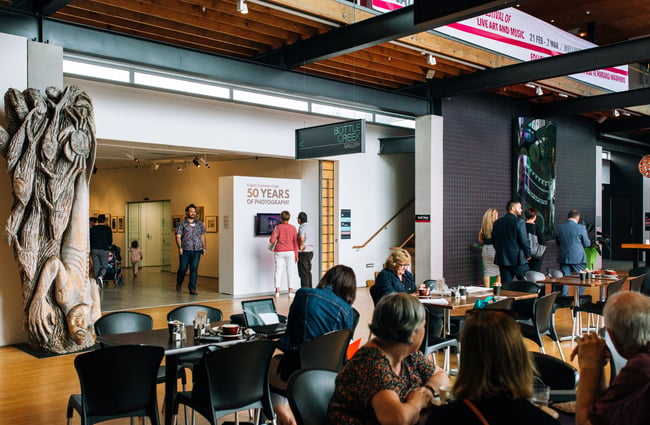 View of the entrance and crowded tables.