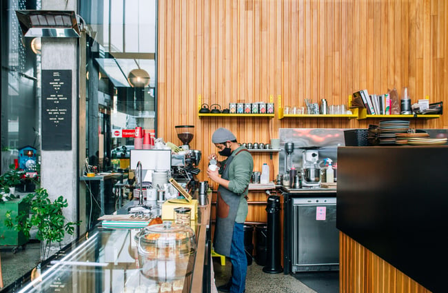 Barista making coffee at Cafe Kopi.