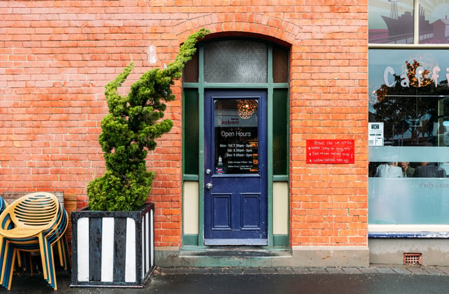 Navy blue door at Caffiend.