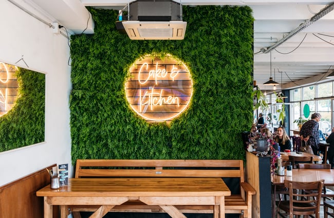 A fake living wall inside Cake & Kitchen.