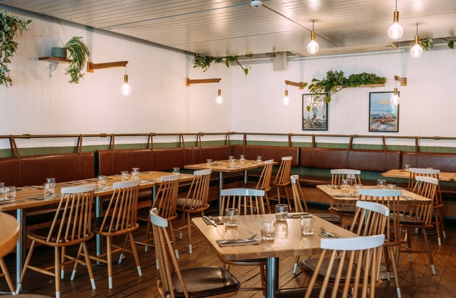 Tables and chairs inside the restaurant at Canyon Brewing Queenstown.