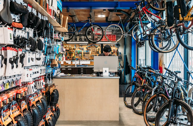 Bikes hanging up on the workshop area of Central Bicycle Studio.