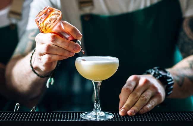 Barperson finishes a cocktail at Charley Noble, Wellington.