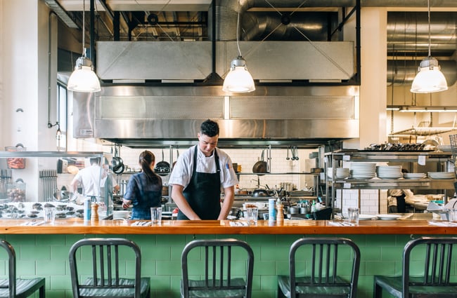 Chef at work in the kitchen at Charley Noble, Wellington.