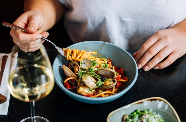Customer digs in to pasta dish at Charley Noble, Wellington.