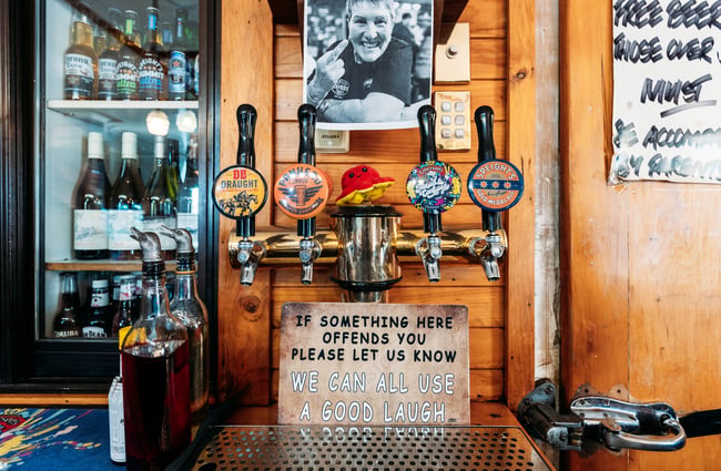 A close up of beer taps behind the bar at Chatto Creek Tavern Central Otago.