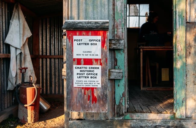 A corrugated iron mail box.