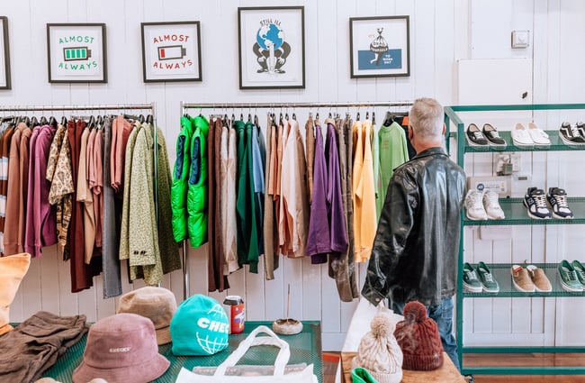 A man browsing the clothing inside Checks Downtown.