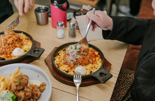 Birds eye view of people eating their food at Child Sister.