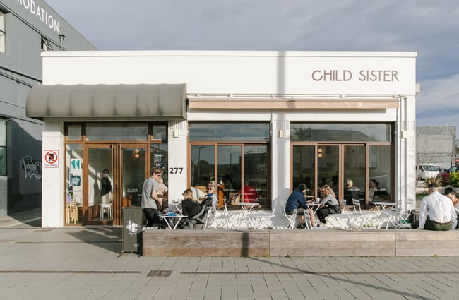 The exterior view of the white building at Child Sister.