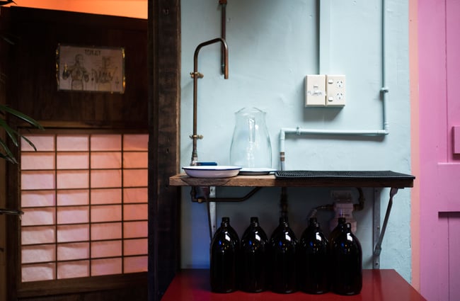 Brown bottles by a water station.
