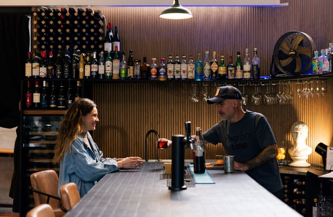 Customer at the bar at Ciao within The Welder.
