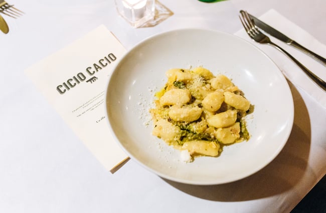 Gnocchi on white plate.