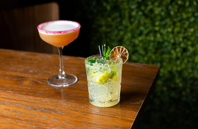 Two cocktails on a table.