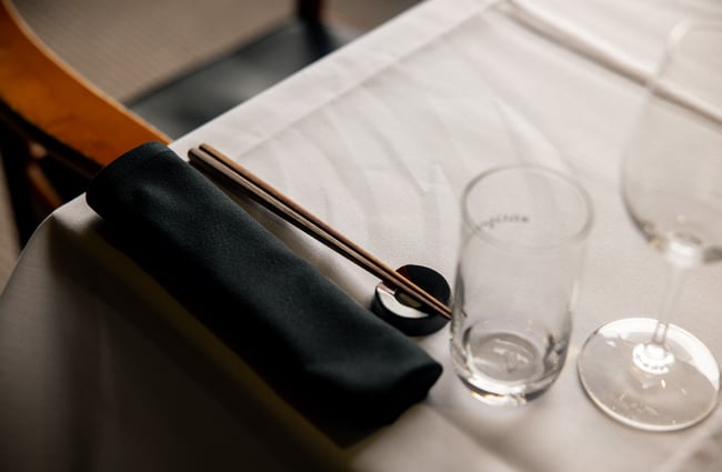A close up of chopsticks on a table.