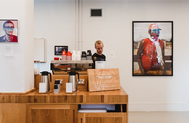 Worker behind coffee machine at  Coffee Supreme Midland Park, Wellington.