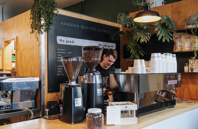 A barista making coffee.