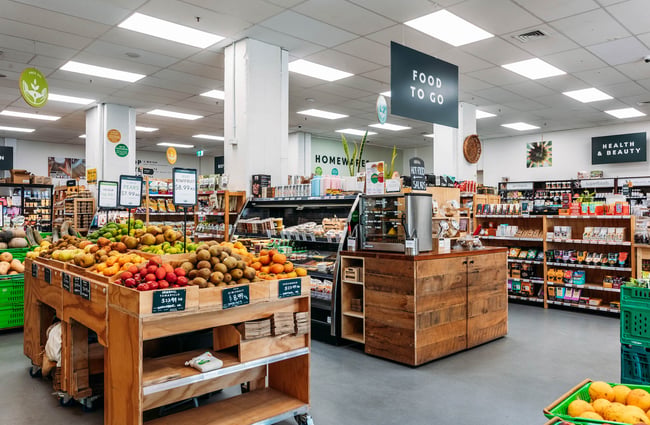 Aisles of pantry items below sign that reads "Food to go" at Commonsense on Tory Street in Wellington