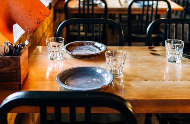Blue glasses and plates on the table at Otto, Auckland.