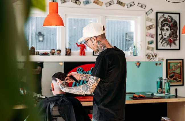 A barber cutting hair.