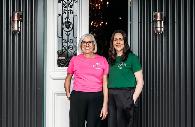 The owners of Country Road High Tea stand outside the front door.