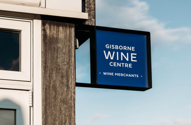 A sign that says 'Gisborne Wine Centre'