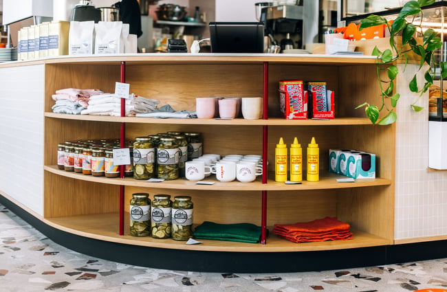 Pickles and chocolates and condiments for sale on the shelves at Cream Eatery in Hamilton.