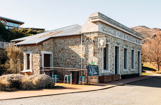 The exterior of an old stone building.