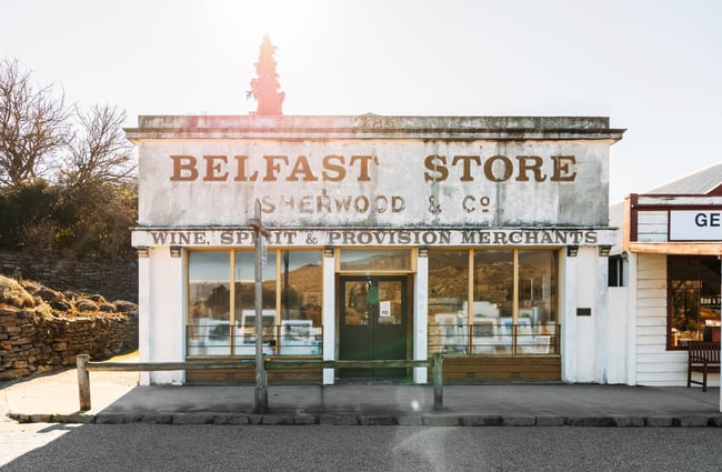 The exterior of an old building on a sunny day.