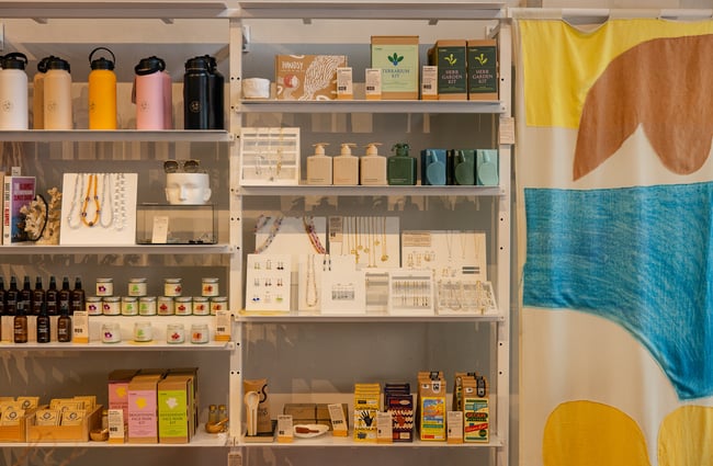 Drinkbottles, body lotions, jewellery etc. on display on the shelves at Crushes.
