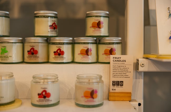 Candles in glass jars on display.