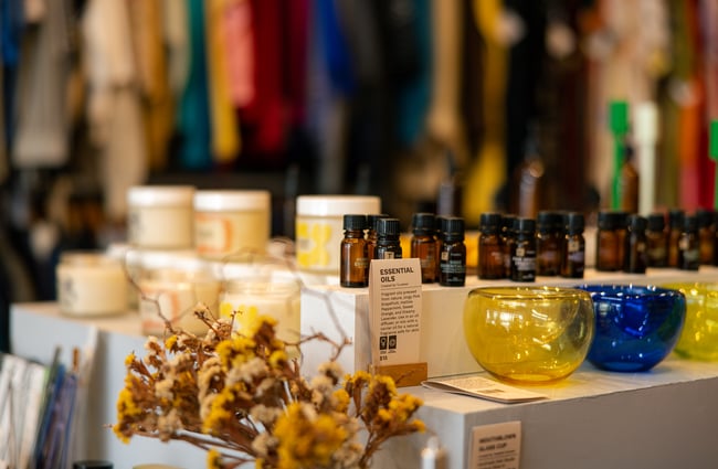 Essential oils in small brown glass bottles on display.