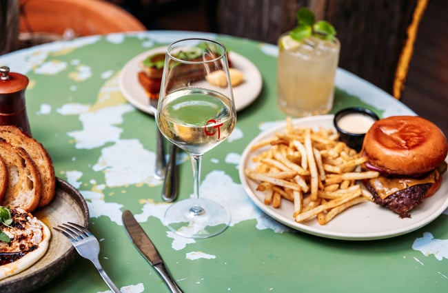 Selection of drinks and dishes on the table at Cuba St Tavern.