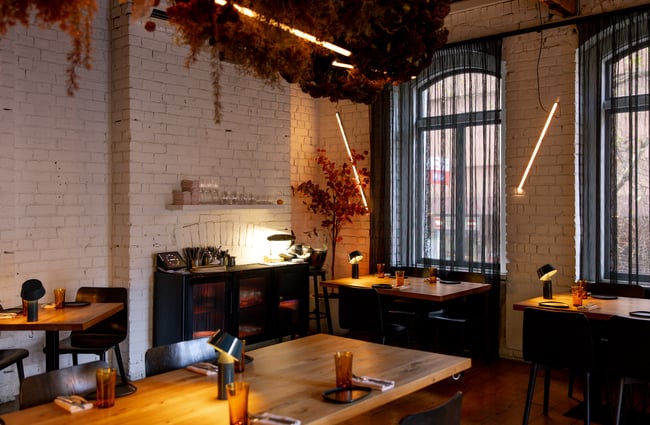 The dimly lit restaurant of Culprit in Auckland.
