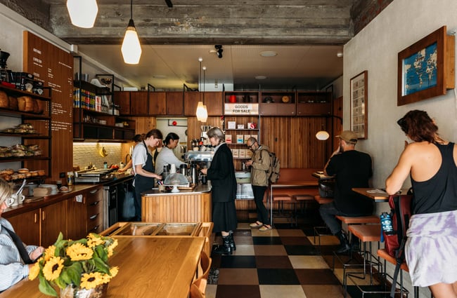 Customers milling about inside Customs Cafe in Wellington.