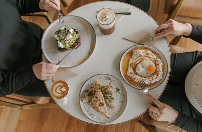 People sitting around a table eating brunch.