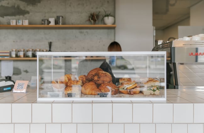 A close up of a glass cabinet on a cafe counter.