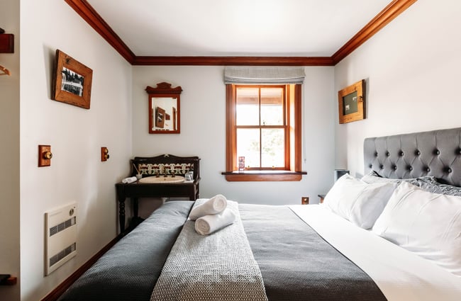 A bedroom inside Danseys Pass Hotel Central Otago.