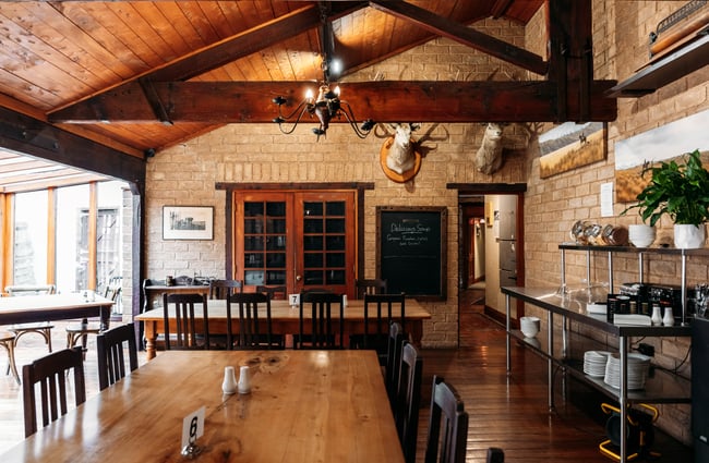 The warm interior of the Danseys Pass Hotel dining room.