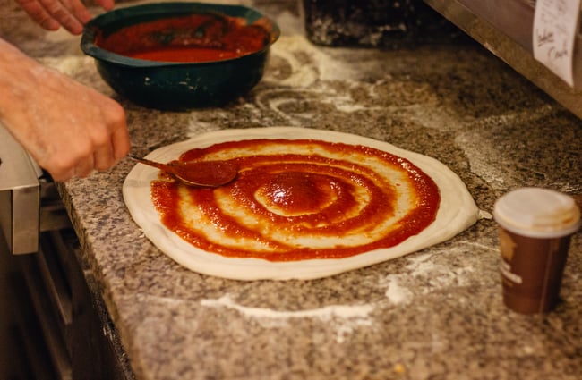 Sauce on pizza.