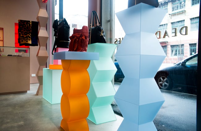 Blue and orange bag stands.