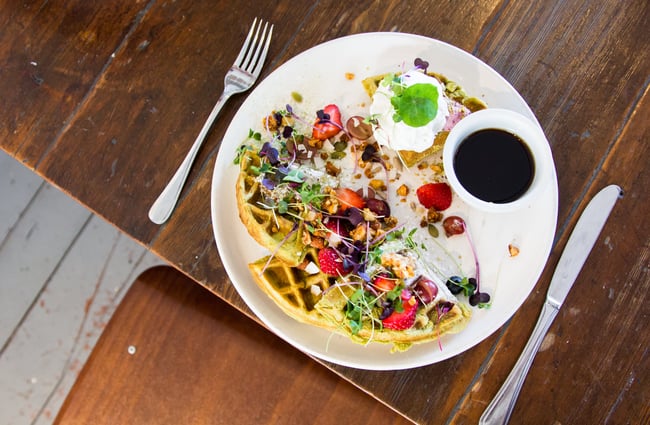 Colourful waffles on a white plate.