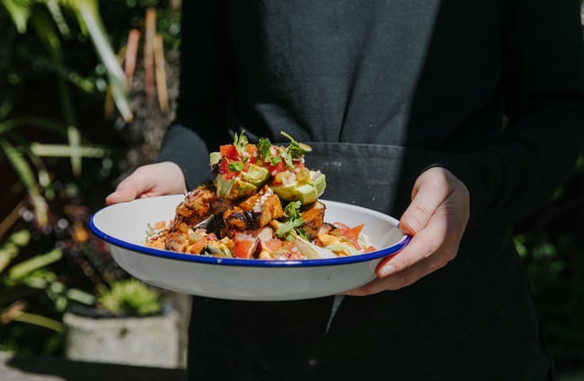 Delicious plate of food with avocado salsa on top from Deville, Nelson.