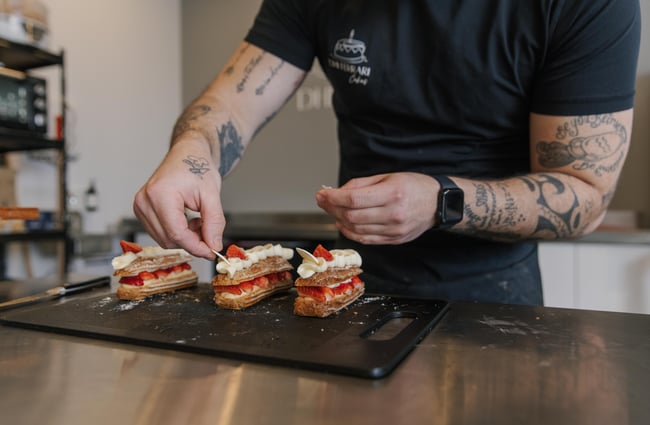 Dhi decorating eclairs.