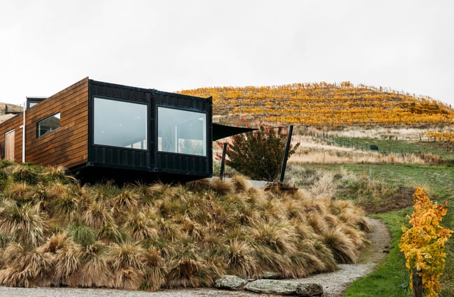 Exterior of Dicey's tasting room set against an autumnal Central Otago landscape.