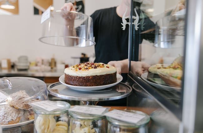 Close up of a carrot cake on the counter at Dispense Espresso in Christchurch.